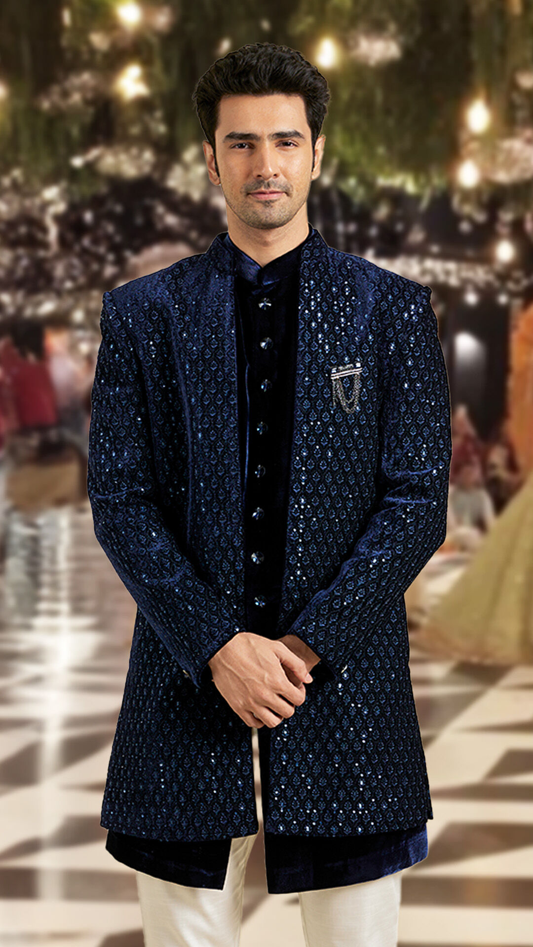 A man wearing stylish blue sherwani with blue jacket for sangeet ceremony